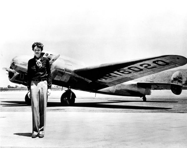 Amelia Earhart standing in front of the Lockheed Electra in which she disappeared in July 29, 1937.